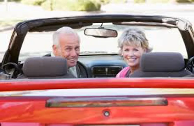 couple in red convertible couple in red convertible